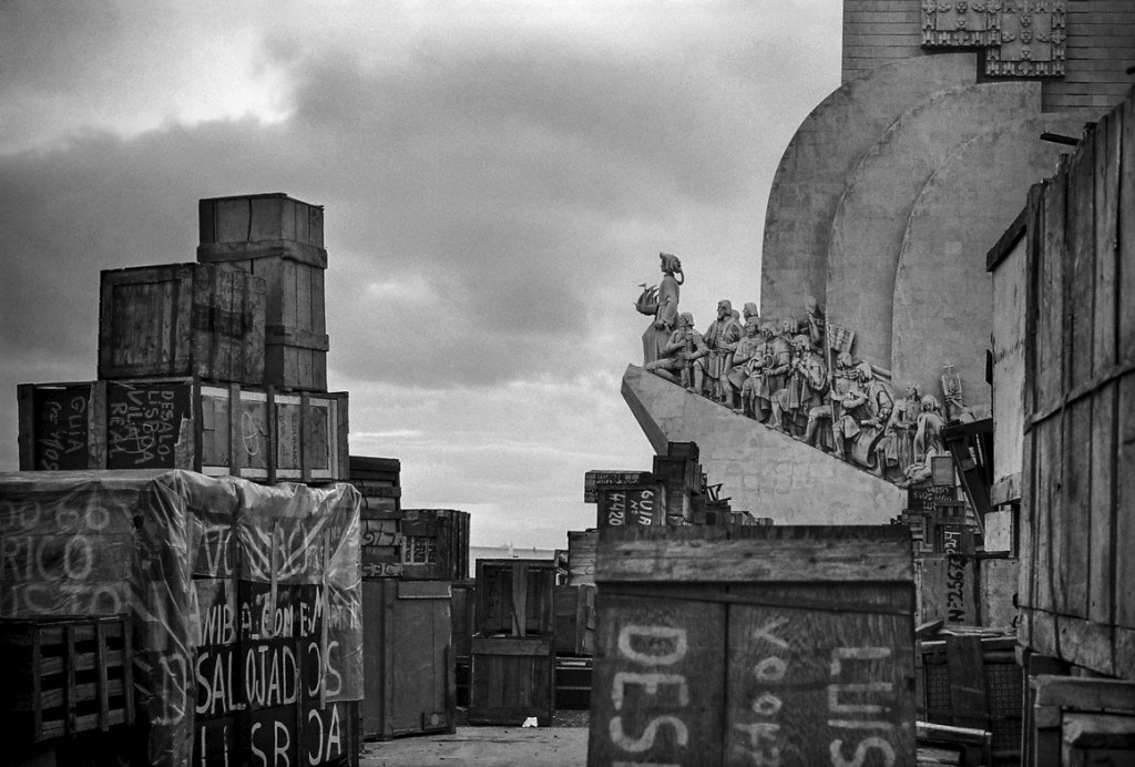 A famous black-and-white image of Belem taken in 1974; the Monument to the Discoveries in Belem is surrounded by crates owned by people fleeing the African colonies after the Empire's collapse.