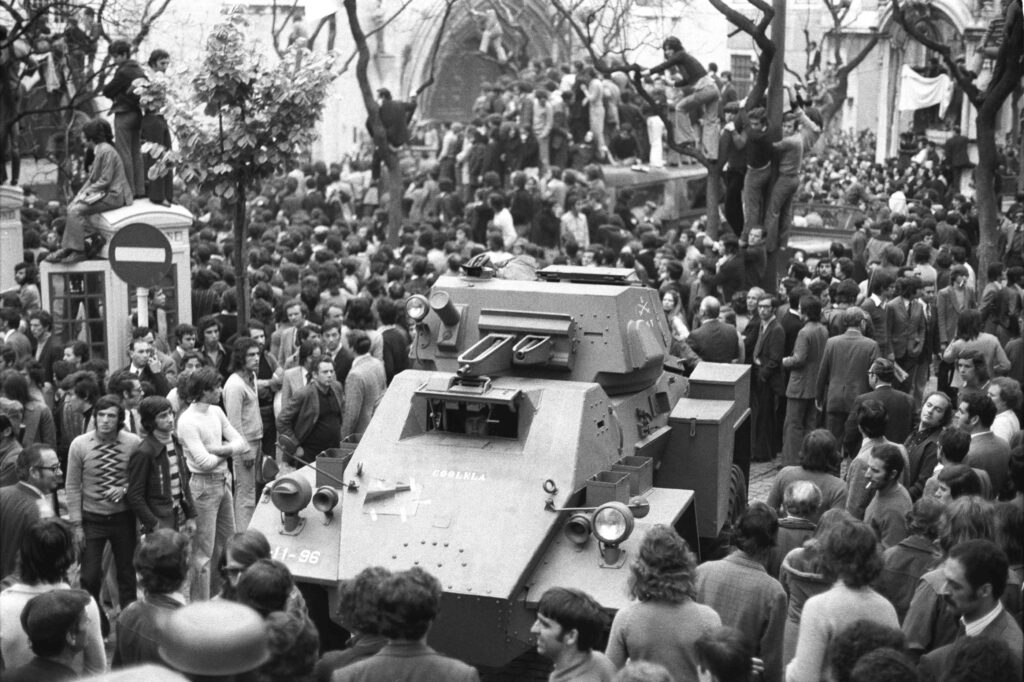 A Chaimite APC is surrounded by people on the day of the Carnation Revolution in Lisbon.
